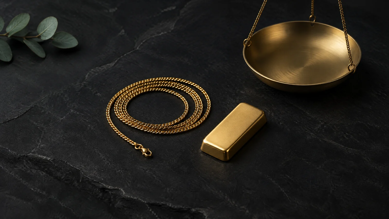 Conceptual gold jewellery, an unmarked bar and a blank weighing pan