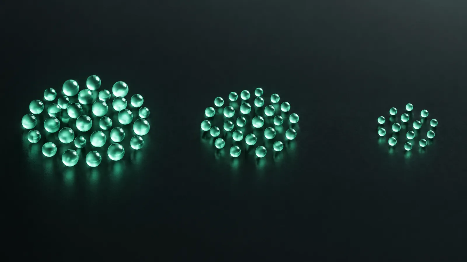 Three separated groups of glowing mint glass spheres on a dark surface, a conceptual illustration of market-size categories